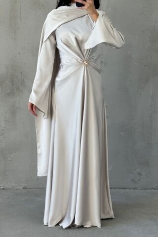 Cream Satin Hijab Evening Dress with Flowing Fabric and Brooch Detail